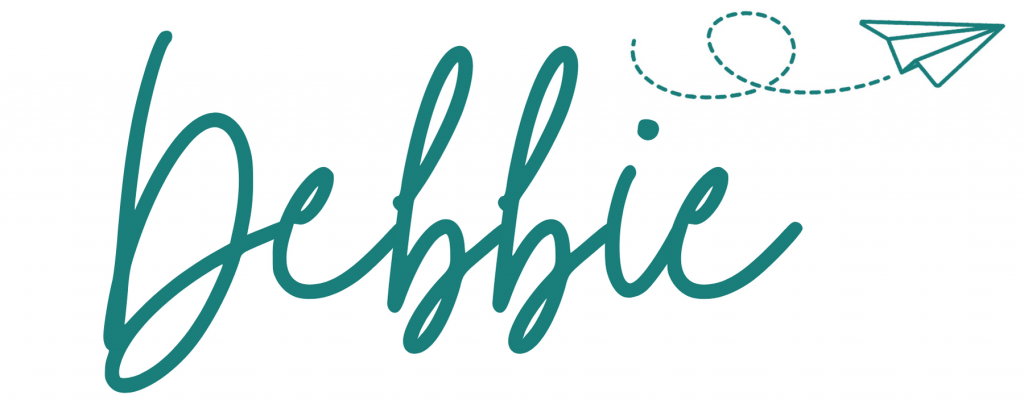 image of the name Debbie in cursive with a paper airplane flying above it
