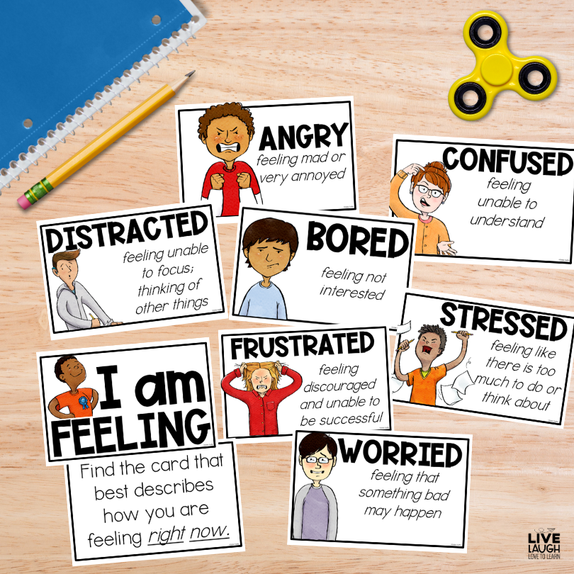 Image of Calm Down Corner Kit "I Am Feeling" cards showing some feelings such as angry, confused, distracted, bored, and frustrated next to a spiral notebook, pencil, and yellow fidget spinner