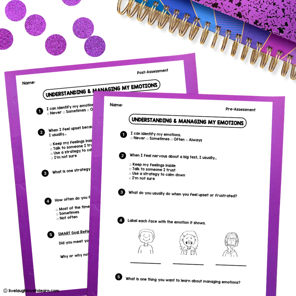 Two purple-framed worksheets titled "Understanding & Managing My Emotions," one labeled as a Pre-Assessment and the other as a Post-Assessment. The worksheets include questions about identifying emotions, strategies for managing feelings, and labeling facial expressions with emotions. They feature both multiple-choice and open-ended questions. The papers are on a desk with purple glitter dots, a colorful spiral notebook, and other classroom supplies nearby