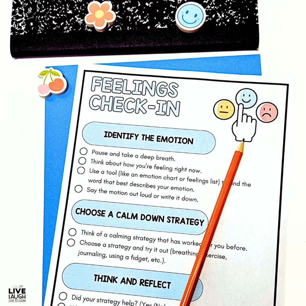 A 'Feelings Check-In' worksheet designed to support emotional regulation by guiding students through identifying their emotions, choosing a calm-down strategy, and reflecting on their feelings. The worksheet includes visual smiley face icons representing different emotions and a checklist format for students to follow. A sharpened orange pencil points to a happy face icon, emphasizing self-awareness in the process. A black composition notebook with cheerful stickers and a blue folder are in the background, reinforcing a positive and student-friendly classroom environment.