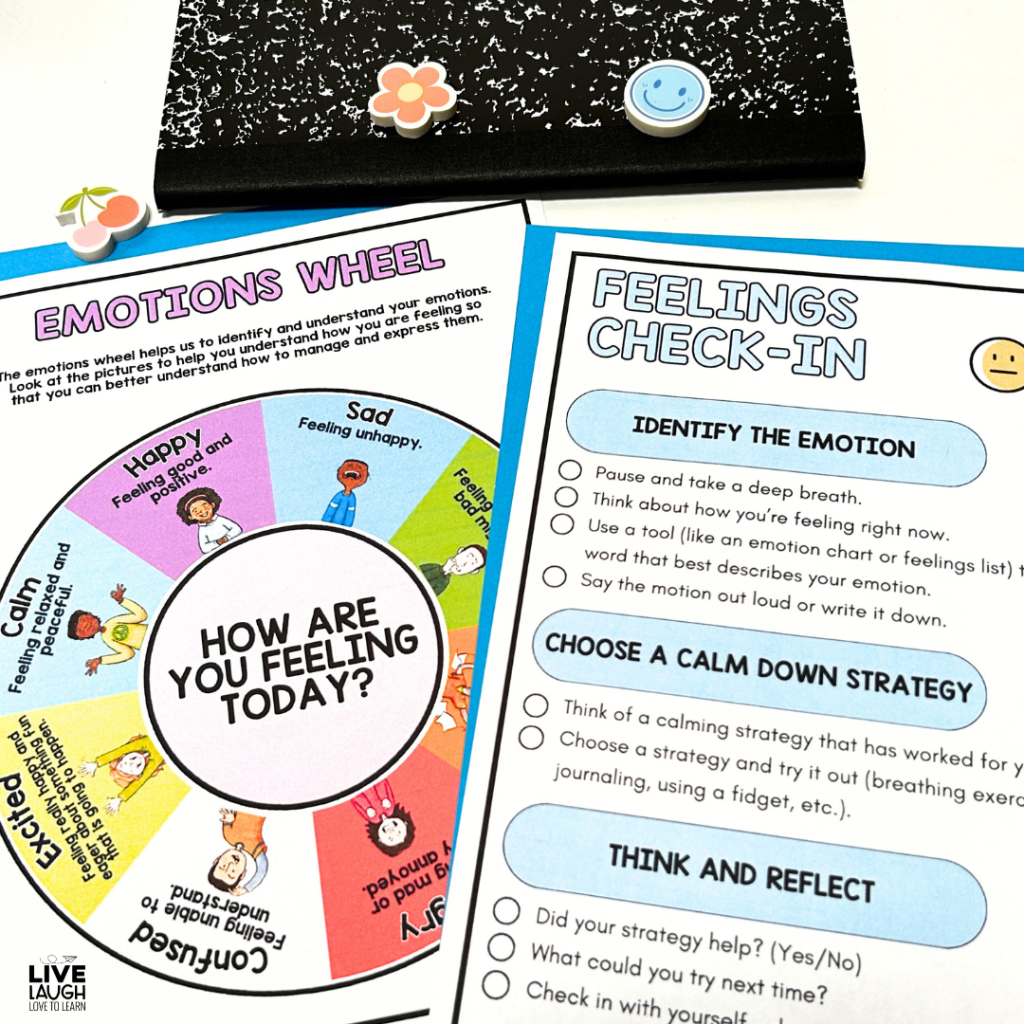 A feelings check-in activity featuring an illustrated emotions wheel labeled 'How Are You Feeling Today?' with sections for different emotions such as happy, sad, calm, and excited. Beside it, a 'Feelings Check-In' worksheet supports emotional regulation by guiding students through identifying their emotions, choosing a calming strategy, and reflecting on their regulation process. A black composition notebook decorated with smiley face and flower stickers is in the background, reinforcing a student-friendly, supportive classroom environment.