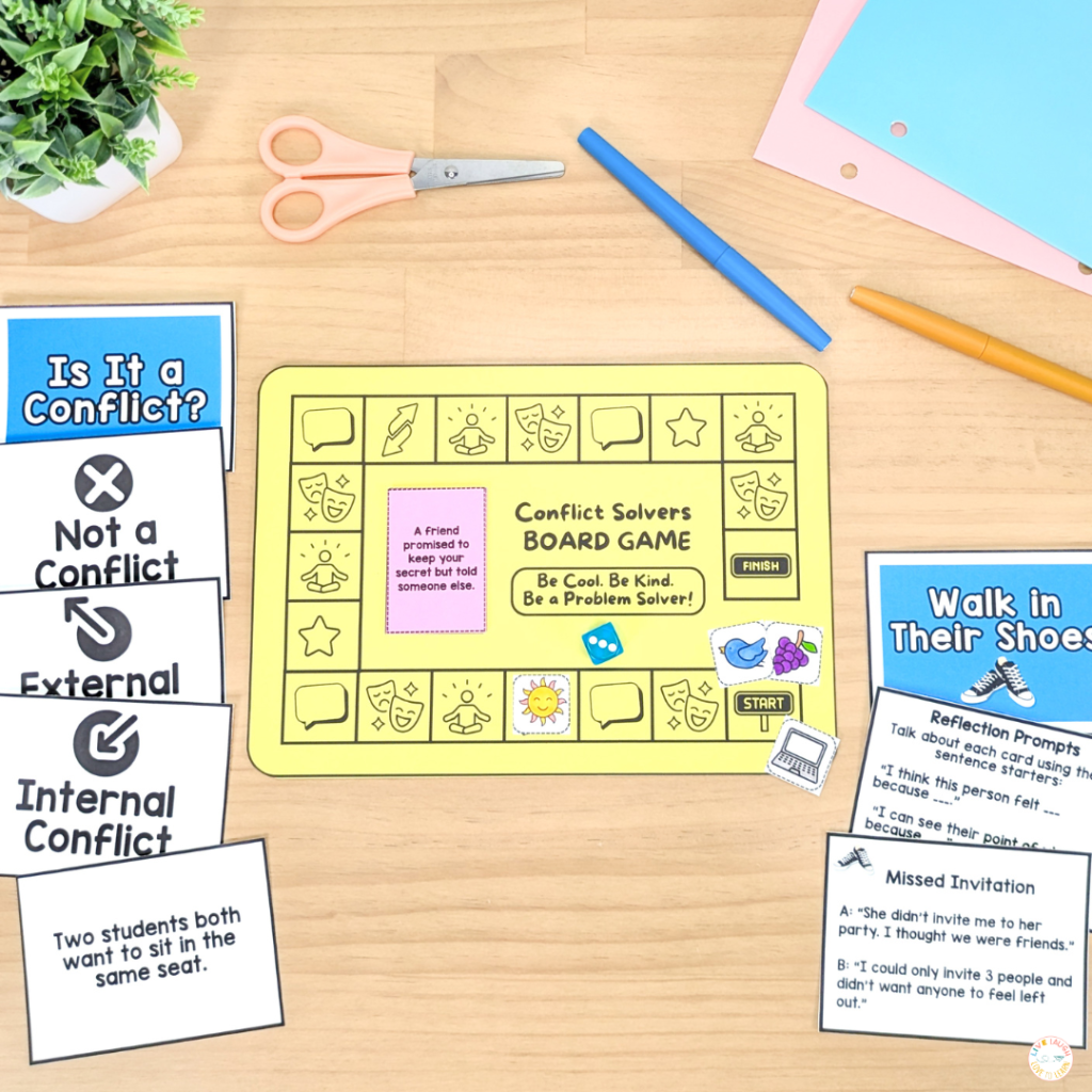 A colorful classroom setup displays a “Conflict Solvers Board Game” on a wooden table surrounded by cards and supplies. The yellow game board encourages students to “Be Cool. Be Kind. Be a Problem Solver!” Nearby cards include conflict scenarios, categories like “Internal Conflict” and “External Conflict,” and reflection prompts titled “Walk in Their Shoes.” Scissors, markers, and pastel paper add a hands-on, engaging feel for teaching conflict resolution through games and role-play.