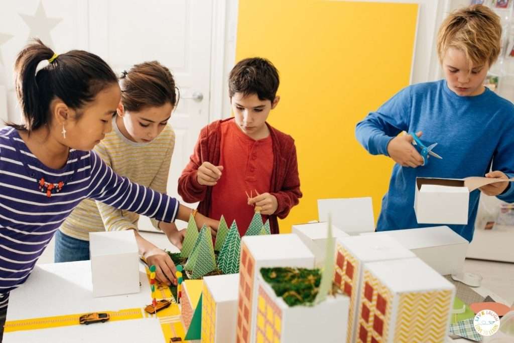 Elementary students building a STEM project with SEL strategies in action