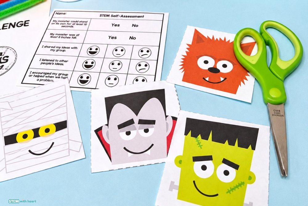 Halloween STEM Challenge self-assessment with teamwork reflection questions, printable monster face templates, and scissors on a blue tabletop.